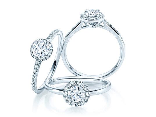 Haloringe: großer Hauptstein und Ring aus Diamanten
