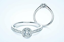 Ringe-Halo mit funkelndem Hauptstein Diamant und einem Kranz aus Diamanten